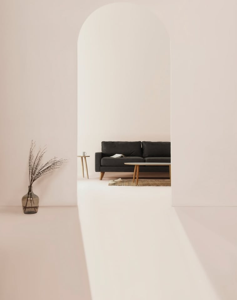 Charcoal Coloured Couch Viewed Through A Doorway